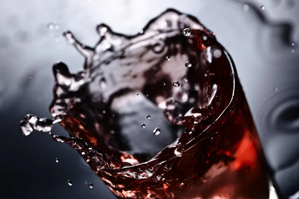 Glass of whiskey with ice on a black background — Stock Photo, Image