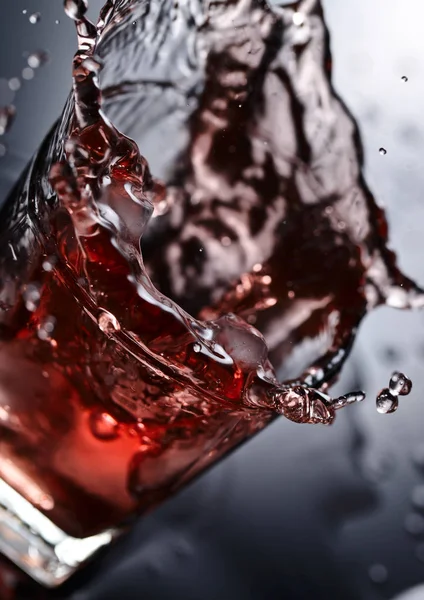 Glass of whiskey with ice on a black background — Stock Photo, Image