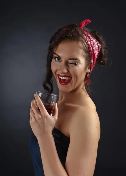 Young beautiful woman with glass of whiskey — Stock Photo, Image