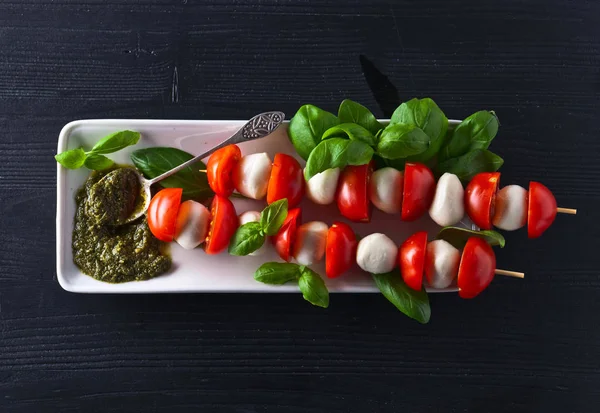 Mozzarella with tomato , basil  and pesto sauce — Stock Photo, Image