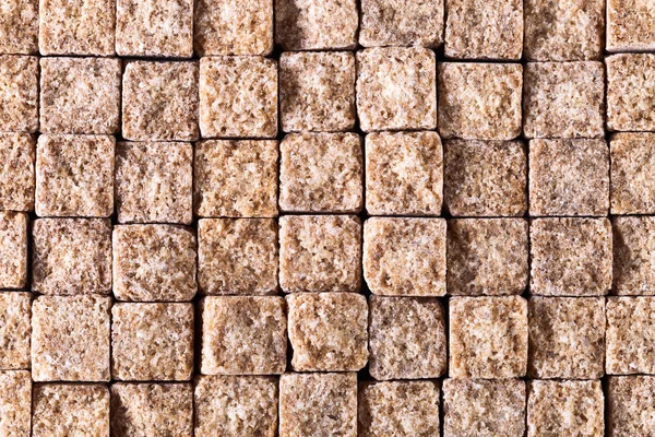 Small pieces of brown sugar , top view — Stock Photo, Image