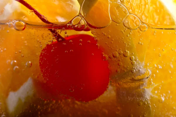 Carbonated drink with orange and sweet cherry — Stock Photo, Image