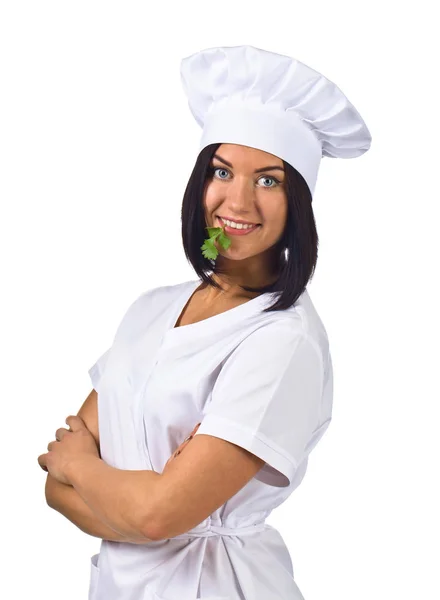 Mujer joven en uniforme de chef con perejil aislado en blanco —  Fotos de Stock