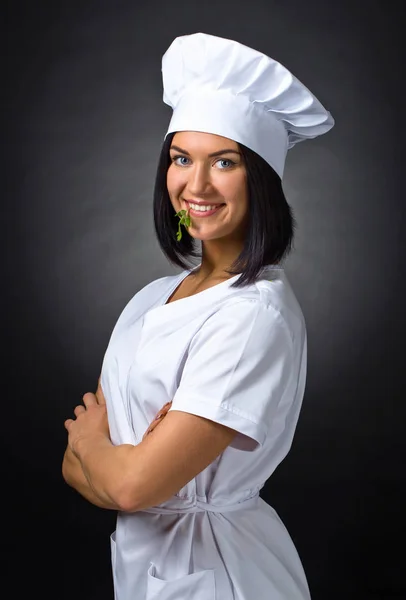 Mulher em uniforme de chef com salsa — Fotografia de Stock