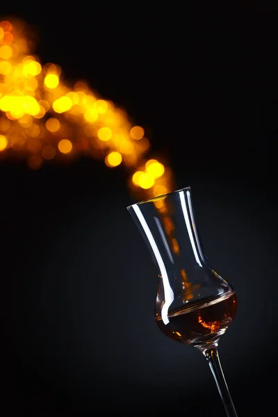 Snifter of brandy on a dark background — Stock Photo, Image