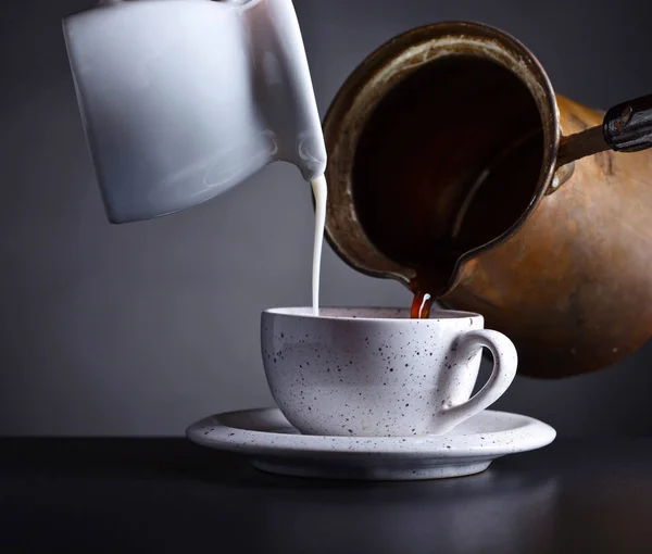 Fresh hot coffee and milk is poured into the Cup — Stock Photo, Image