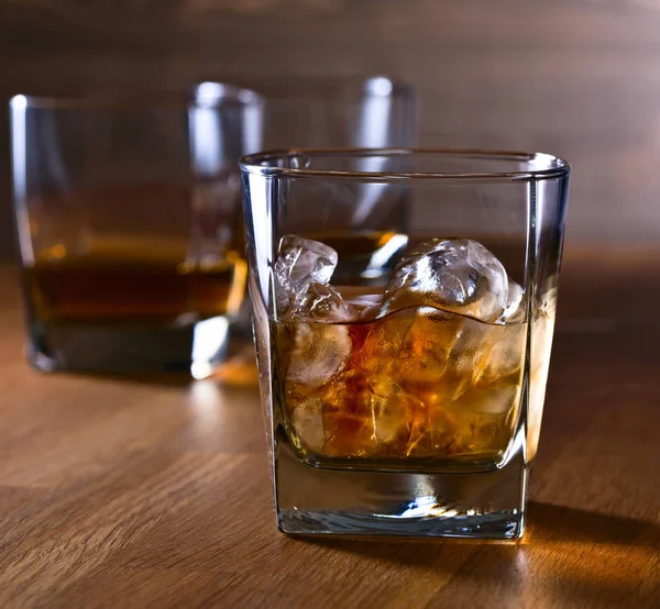 Glasses of whiskey with natural ice — Stock Photo, Image