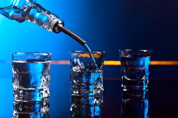 Vodka in bar on a black  background — Stock Photo, Image