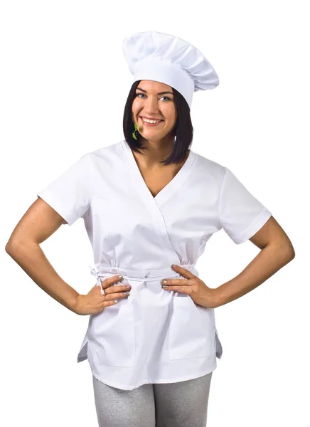 Jovem mulher em uniforme de chef com salsa isolada em branco — Fotografia de Stock