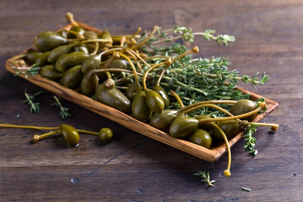 Canned capers and thyme — Stock Photo, Image