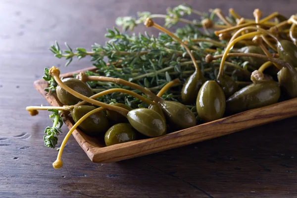 Canned capers and thyme — Stock Photo, Image