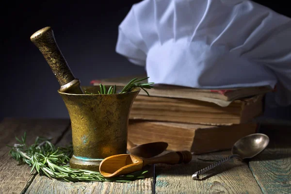 Kitchen accessories on the old wooden table .