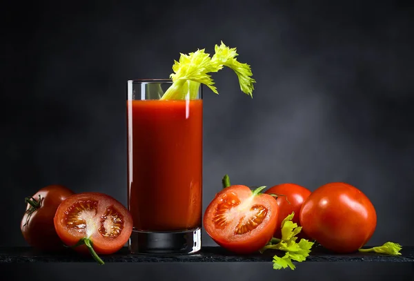 Tomato juice with tomatoes and celery sticks — Stock Photo, Image