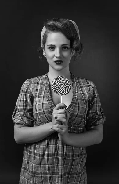 Young beautiful woman with candy — Stock Photo, Image