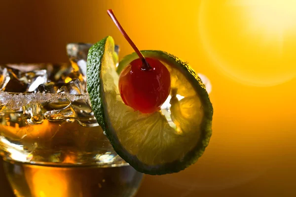 Alcoholic cocktail with cherry and lime. — Stock Photo, Image