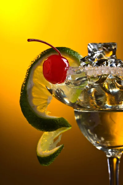 Alcoholic cocktail with cherry and lime. — Stock Photo, Image