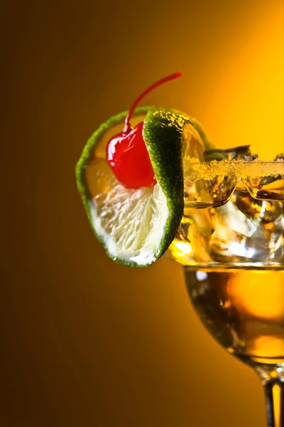 Alcoholic cocktail with cherry and lime. — Stock Photo, Image