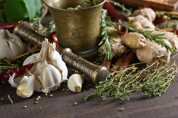 Different herbs and spices on a wooden table . — Stock Photo, Image