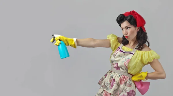 Beautiful woman with cleaning accessory . — Stock Photo, Image