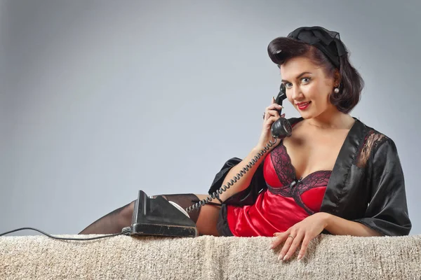 Beautiful woman speaking via vintage phone. — Stock Photo, Image