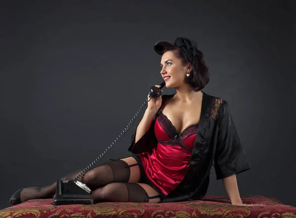 Beautiful woman speaking via vintage phone. — Stock Photo, Image