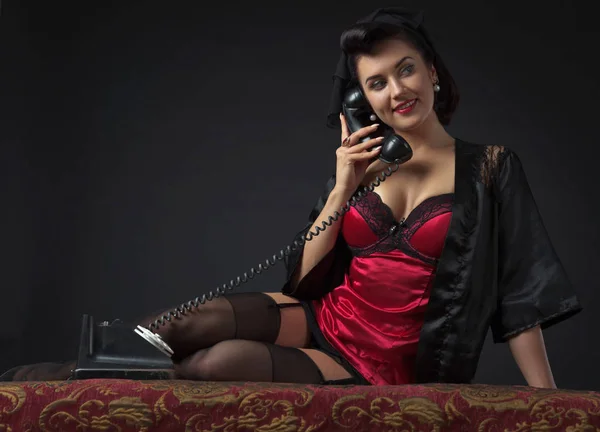 Beautiful woman speaking via vintage phone. — Stock Photo, Image