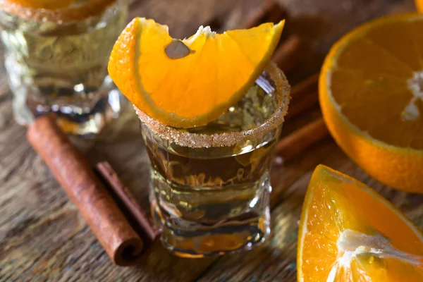 Tequila with orange and cinnamon . — Stock Photo, Image