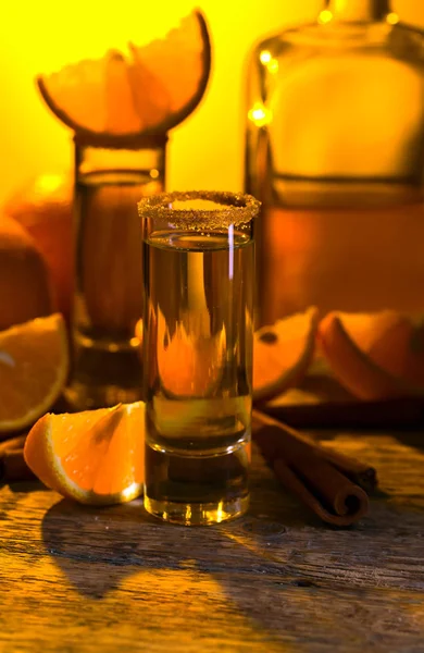 Tequila with orange and cinnamon . — Stock Photo, Image