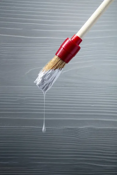 Paintbrush with white paint . — Stock Photo, Image