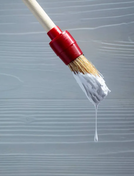 Paintbrush with white paint . — Stock Photo, Image