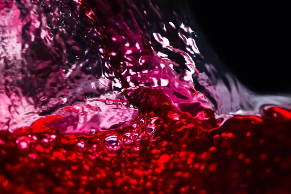 Red wine on black background Royalty Free Stock Images