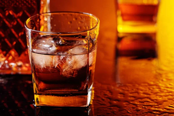 Glass of scotch whiskey with natural ice . — Stock Photo, Image