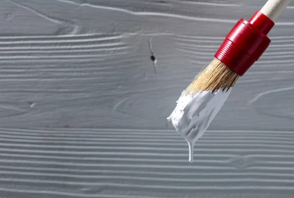 Paintbrush with white paint . — Stock Photo, Image