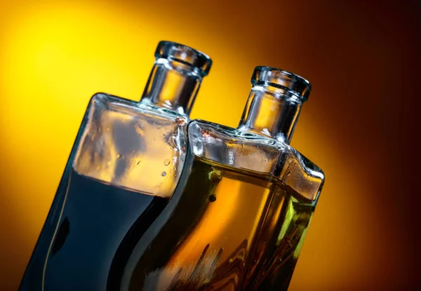 Bottles of flavored olive oil and balsamic vinegar . — Stock Photo, Image