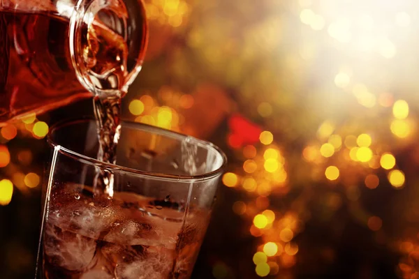 Whiskey is poured from a carafe into a glass . — Stock Photo, Image