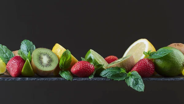 Different juicy fruits and mint leaves . — Stock Photo, Image