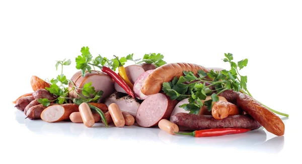 Different sausages and smoked meats isolated on white . — Stock Photo, Image