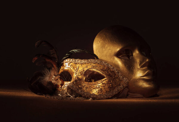  Two golden Venetian masks 