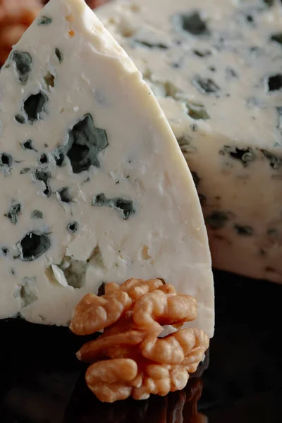 Wedges of soft blue cheese with walnuts. — Stock Photo, Image