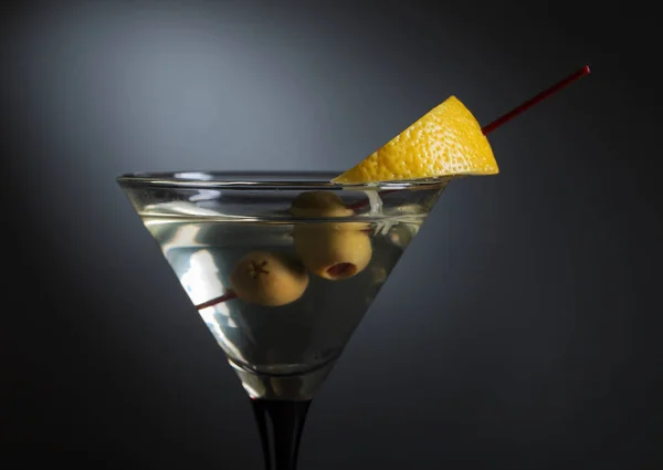 Martini with lemon and green olives — Stock Photo, Image