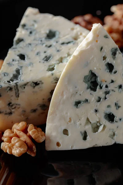 Wedges of soft blue cheese with walnuts. — Stock Photo, Image