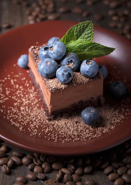 Chocolate cake with blueberries and mint . — Stock Photo, Image