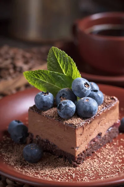 Chocolate cake with blueberries and mint . — Stock Photo, Image