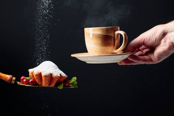 Muffin with cranberries and mint sprinkled with sugar powder.  M