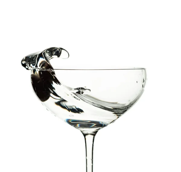 Martini and green olive in glass with splashes isolated on white — Stock Photo, Image