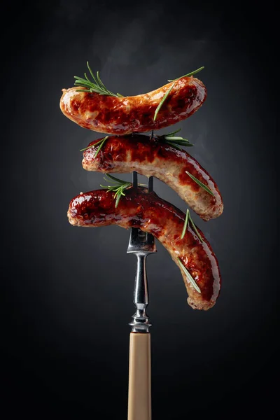 Grilled Bavarian sausages with rosemary. — Stock Photo, Image