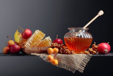 Honey and  small wild apples. clipart