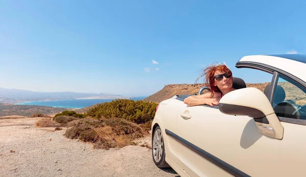 Happy Mature Woman Sunglasses Convertible Top Automobile Mountain Road Sunny — Stock Photo, Image