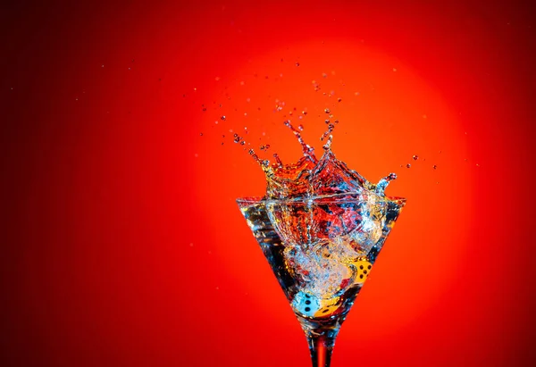 Dice Fall Glass Martini Colourful Cocktail Glass Splash Red Background — Stock Photo, Image