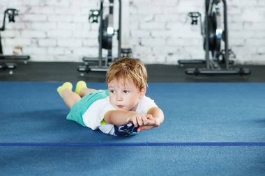 Children doing push ups in PE in elementary school clipart